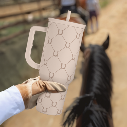 Brown Horse Slidemate 40oz beige slider tumbler with straw in hand outdoors