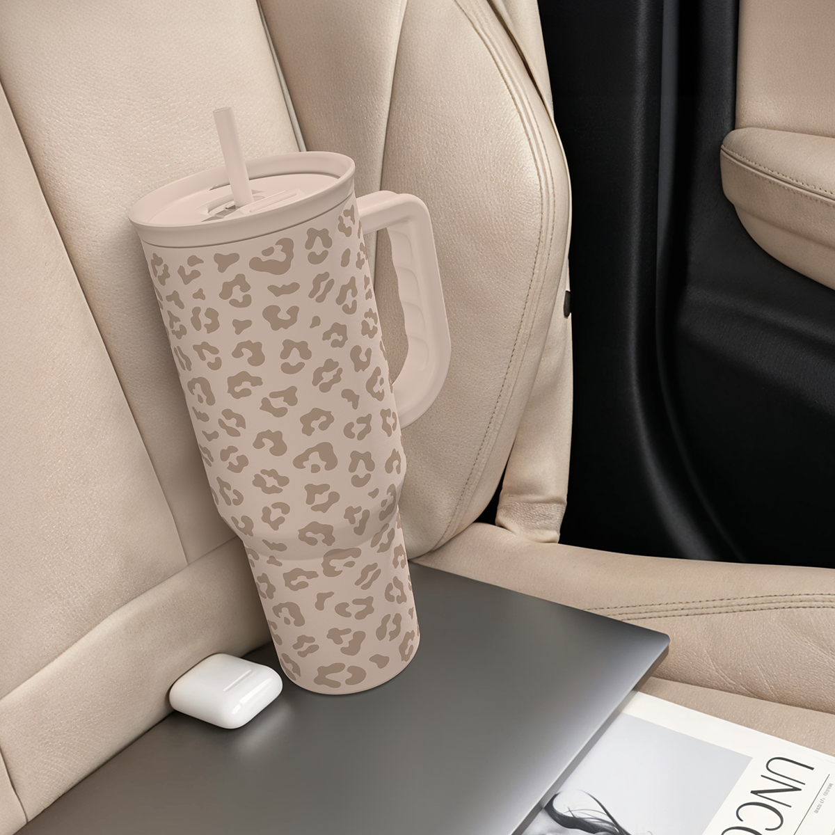 Leopard-print 40 oz tumbler with handle and straw, beige tan spots in car