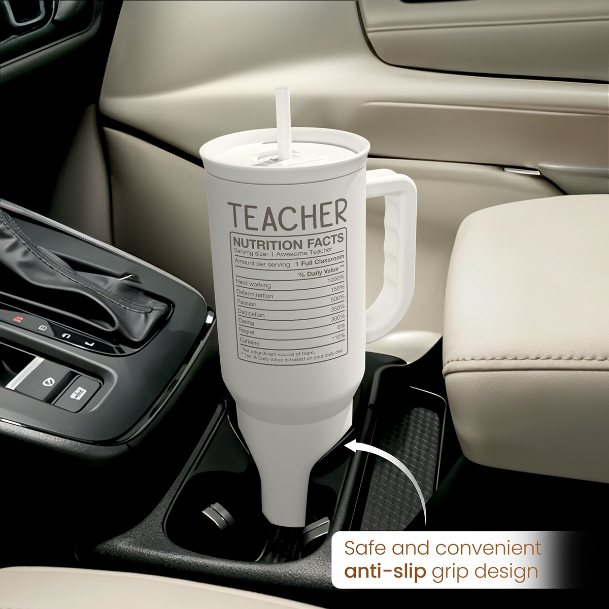 White tumbler with handle and straw in car console, TEACHER nutrition facts label