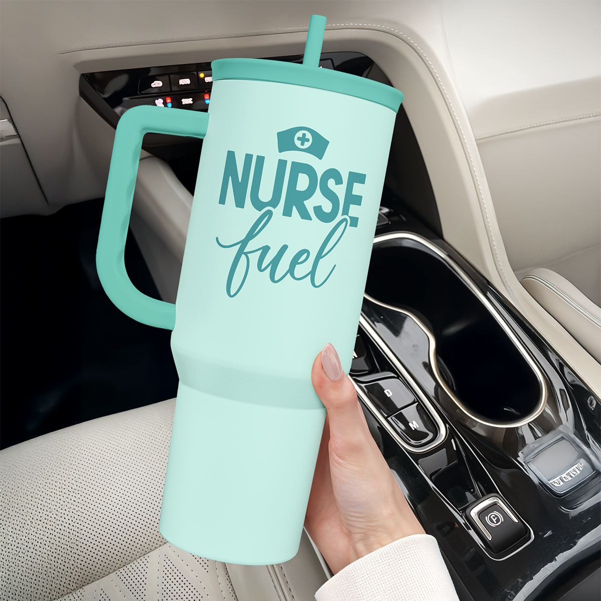 Mint 40oz tumbler with straw and handle held upright