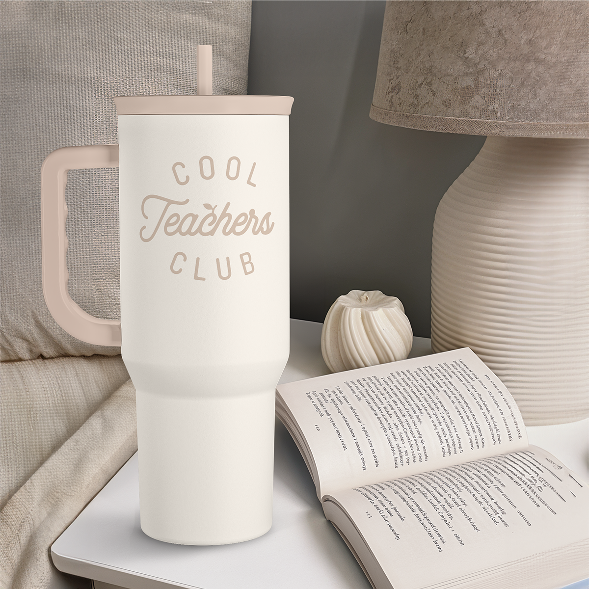 White 40oz tumbler with handle, straw, and “Cool Teachers Club” logo on front