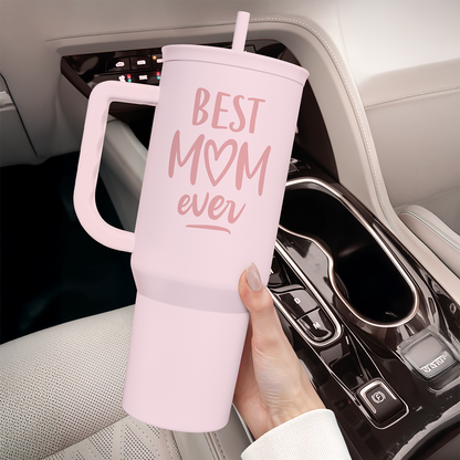 Pink 40oz tumbler with handle, 'Best Mom ever' print, held in a car cupholder
