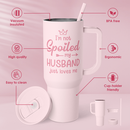 Pink insulated tumbler with handle and straw; “I’m not Spoiled my HUSBAND” design