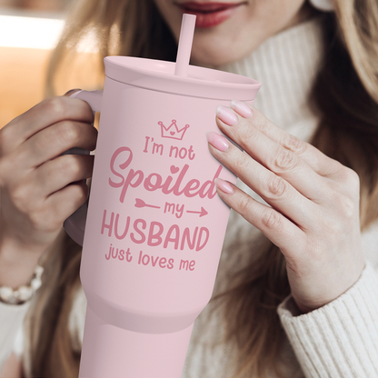 Pink 40oz tumbler with straw and handle; “I’m not Spoiled my HUSBAND” front text