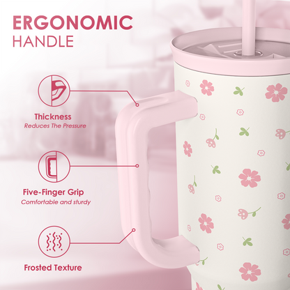 Pink floral 40oz tumbler with ergonomic handle and straw lid close-up