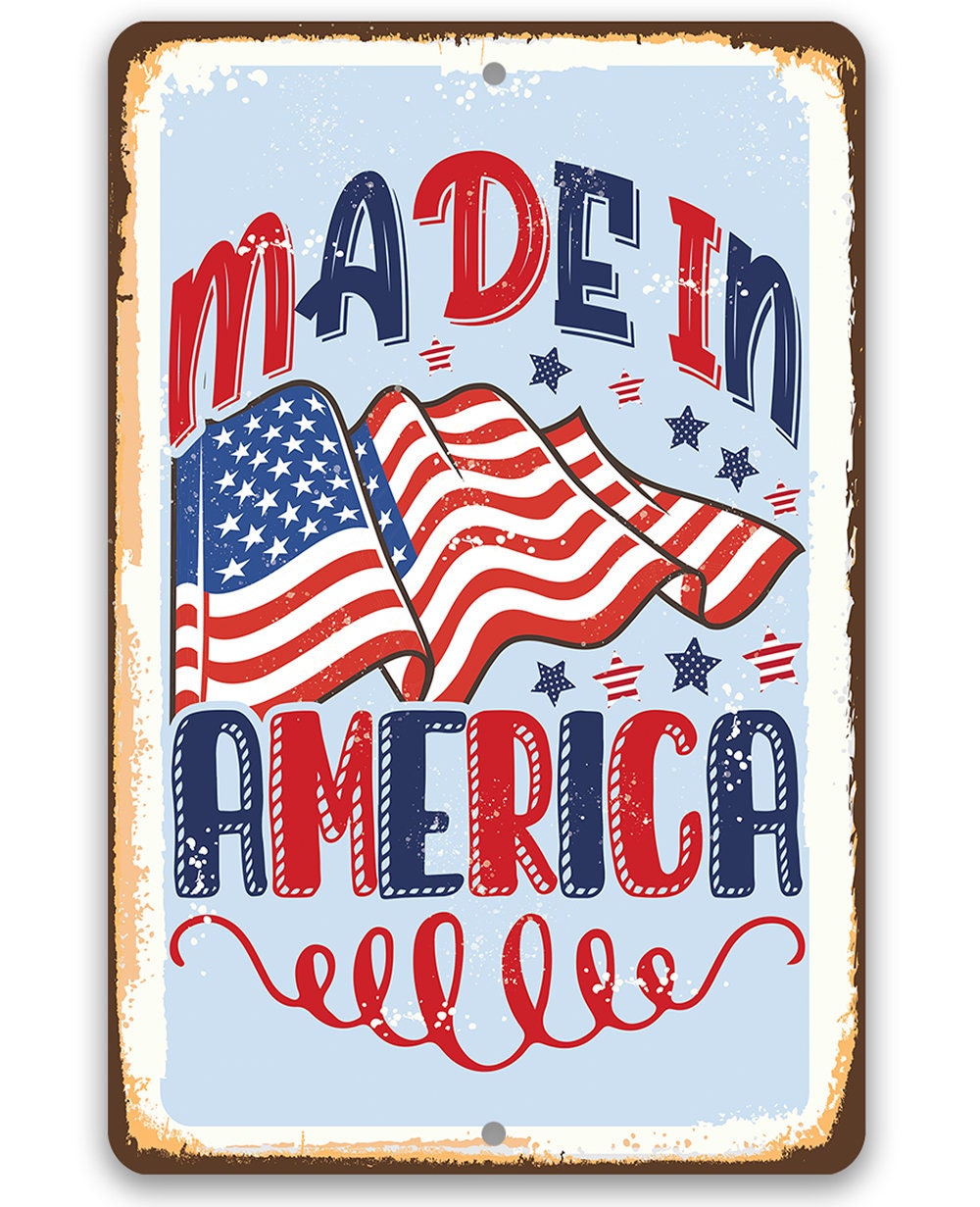 Patriotic metal sign with “Made in America” text and waving American flag graphic