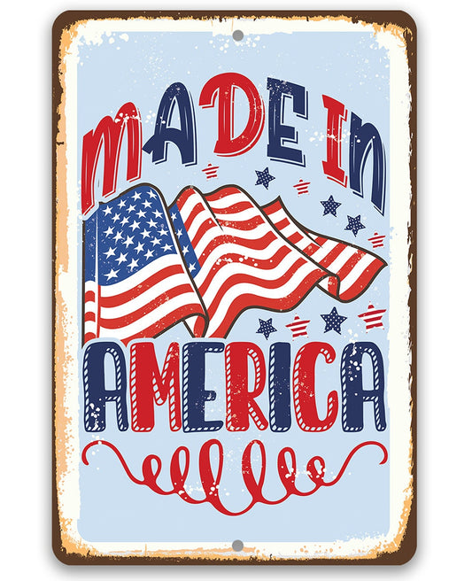 Patriotic metal sign with “Made in America” text and waving American flag graphic