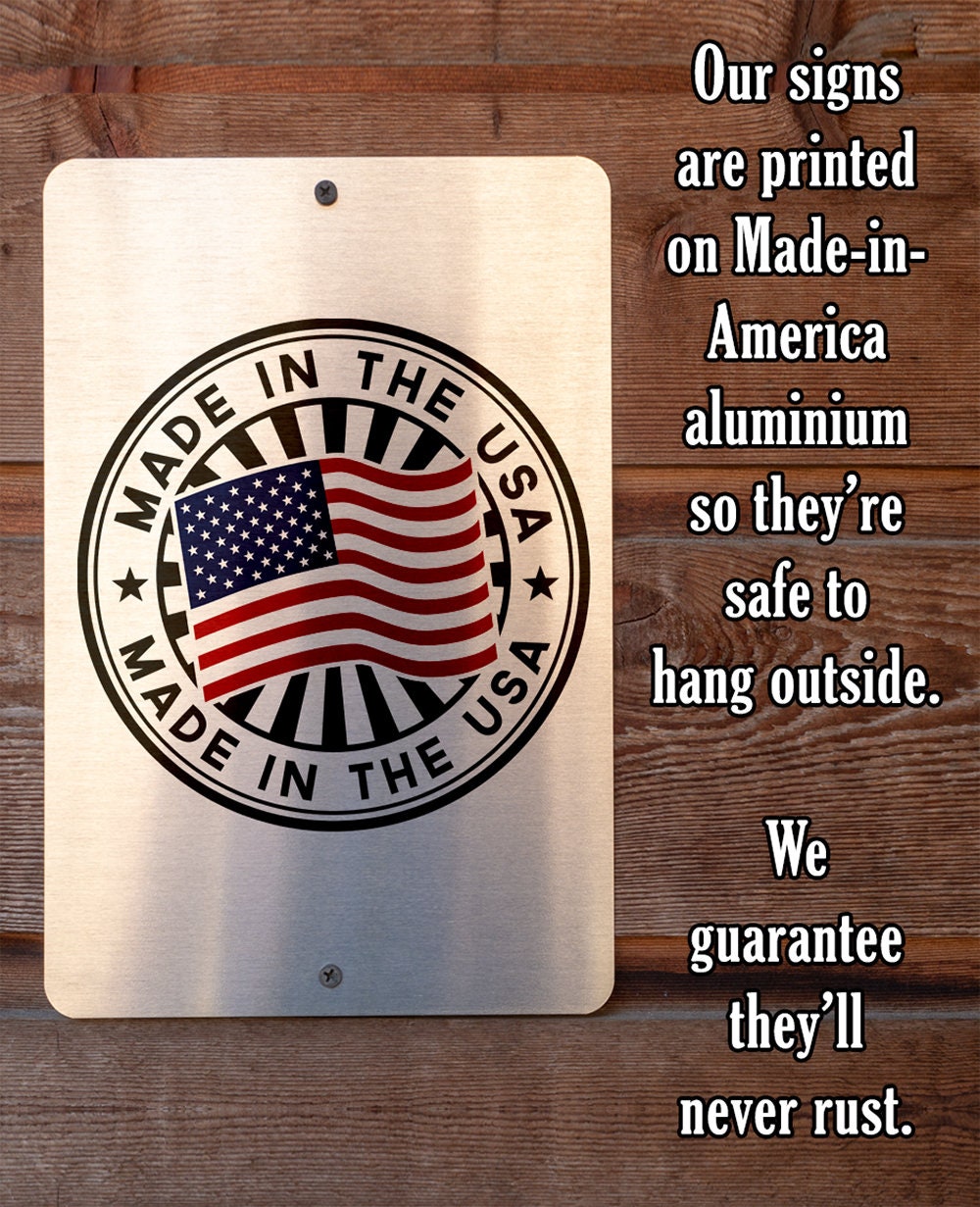 Beige metal sign with round “Made in the USA” seal and “never rust” text