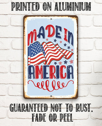 Aluminum metal sign reading “Made in America” with American flag and stars