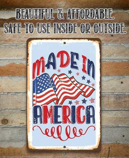 Patriotic metal sign with “Made in America” lettering and American flag illustration