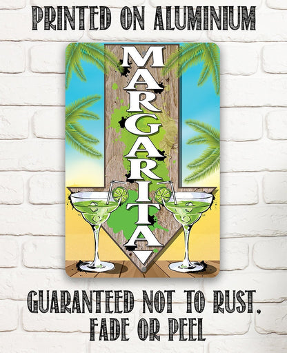 Directional metal sign with margarita glasses and stacked MARGARITA letters, palm backdrop