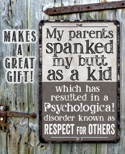 Black metal sign with “My parents spanked my butt as a kid” text on weathered boards
