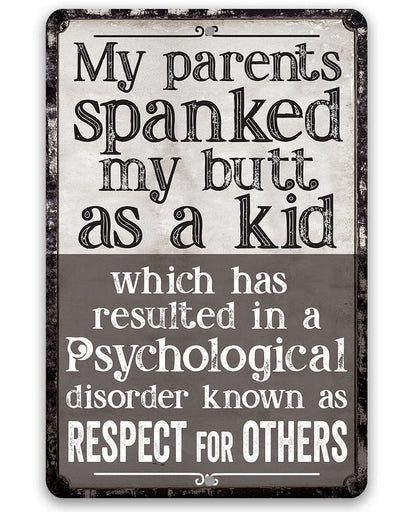 Black metal sign with bold “My parents spanked my butt as a kid” lettering and quote