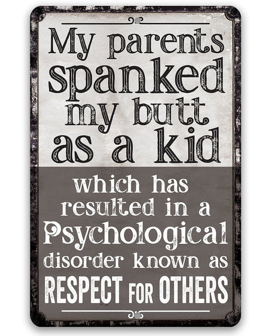 Black metal sign with bold “My parents spanked my butt as a kid” lettering and quote