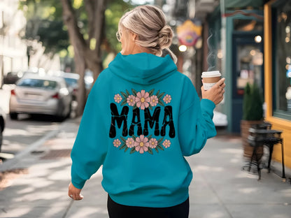 Teal hoodie worn from the back with floral MAMA script graphic
