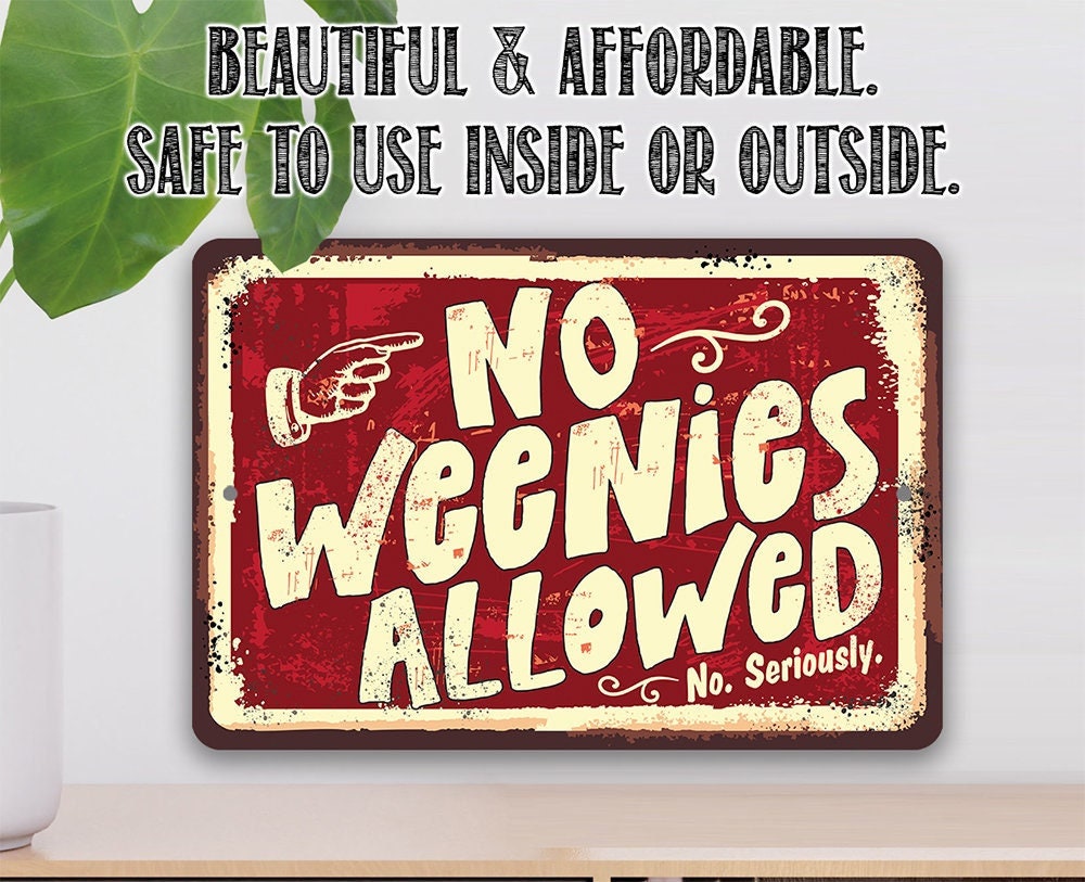 Red and cream “No Weenies Allowed” metal sign with rounded corners and border