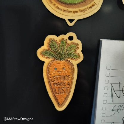 Carrot-themed magnetic pen keeper magnet with face and green leaves on fridge