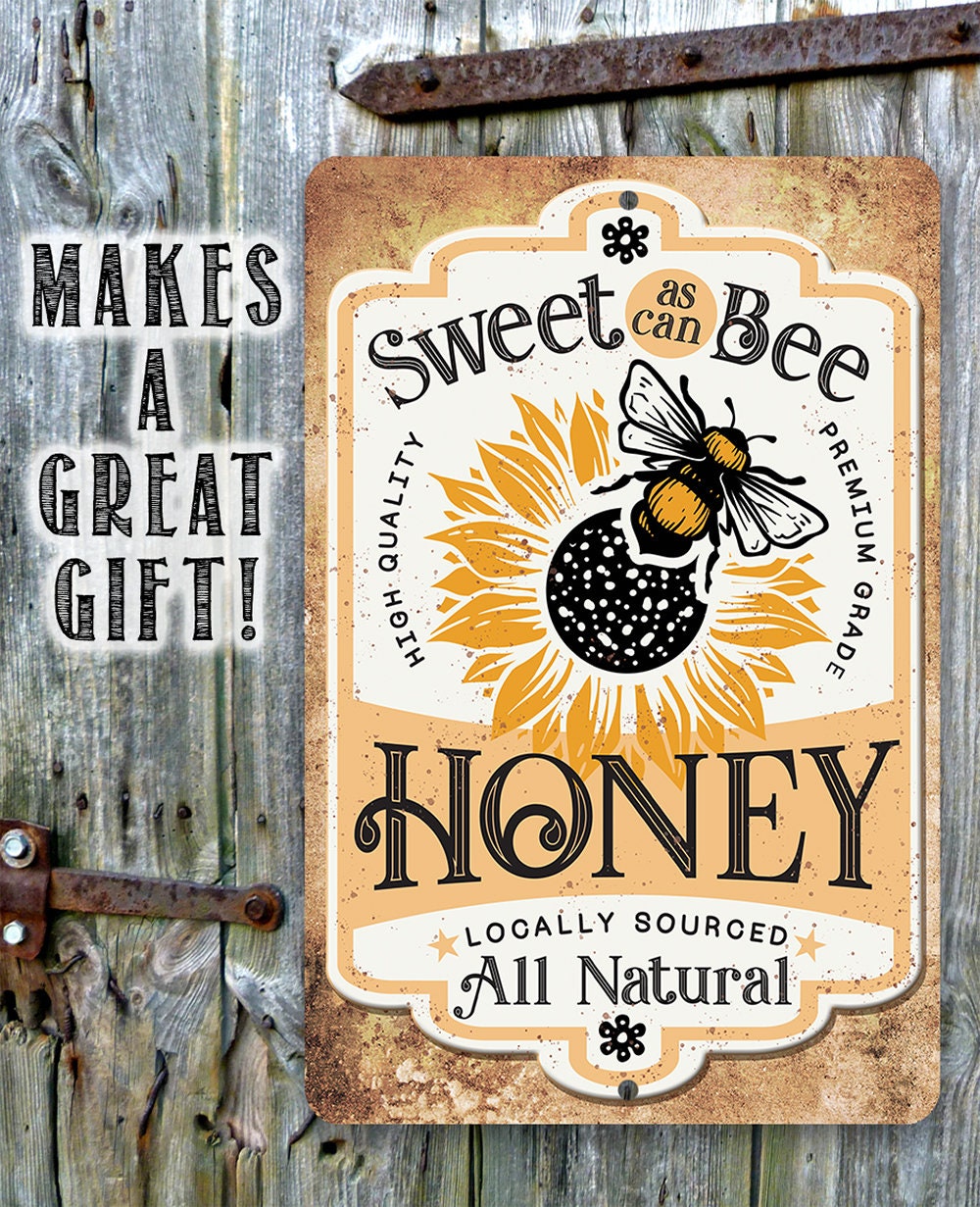 Honey metal sign with 'Sweet as can Bee' and 'Honey' on distressed tan background