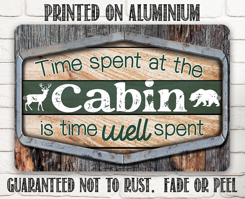 Cabin metal sign on aluminum with “Time spent at the Cabin” wording and deer silhouettes