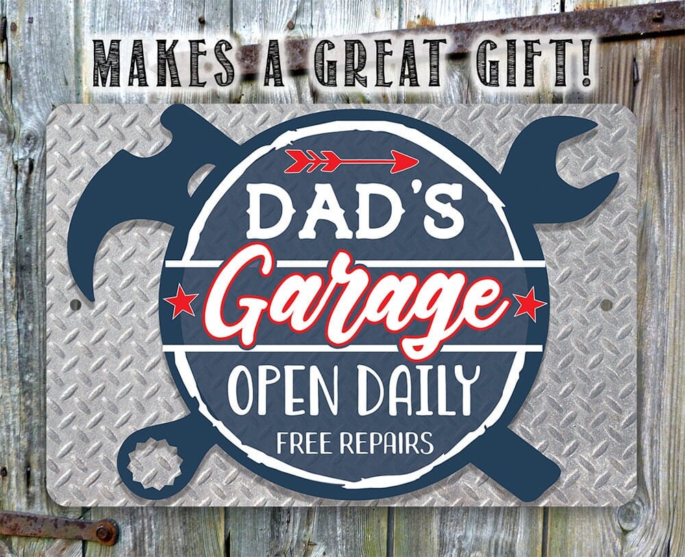 Blue 'Dad's Garage' open daily free repairs metal sign with large wrench shapes
