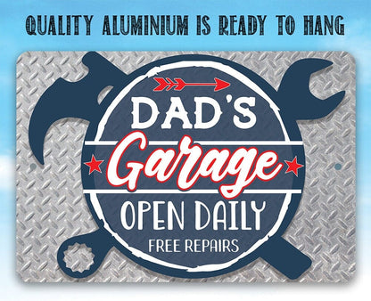 Blue 'Dad's Garage' open daily free repairs metal sign on diamond-plate texture