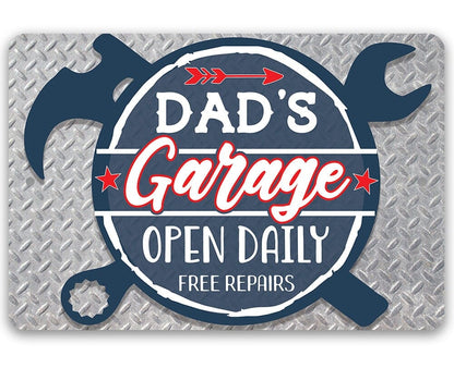 Blue 'Dad's Garage' open daily free repairs metal sign with wrench icons