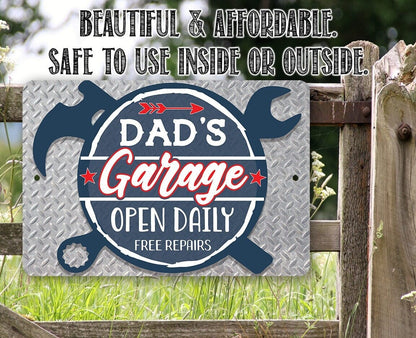 Blue 'Dad's Garage' open daily free repairs metal sign with shield and wrench marks
