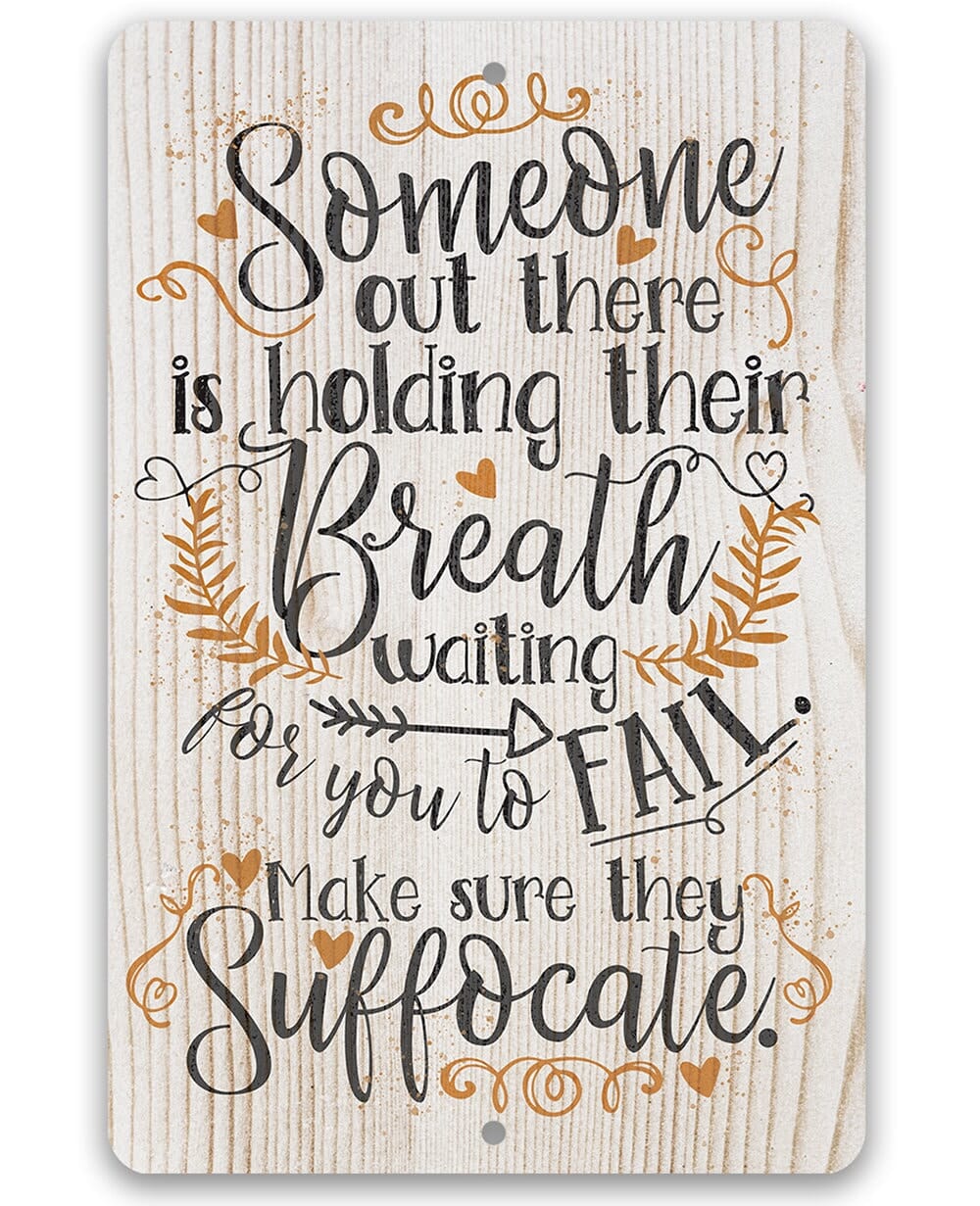 Metal sign with 'Someone out there is holding their Breath' quote in decorative script