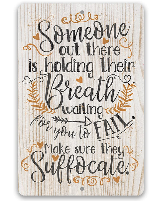 Metal sign with 'Someone out there is holding their Breath' quote in decorative script