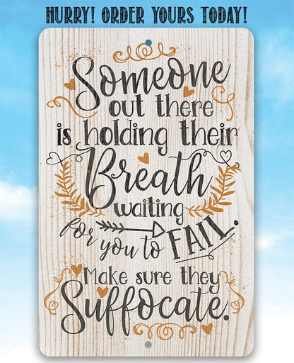Metal sign with 'Someone out there is holding their Breath' quote and warm-toned accents