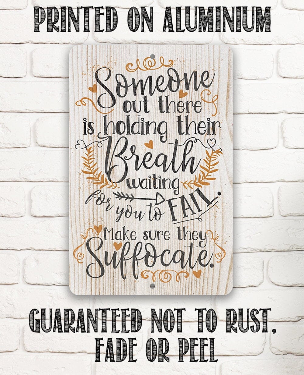 Metal sign showing 'Someone out there is holding their Breath' with leaf and heart accents
