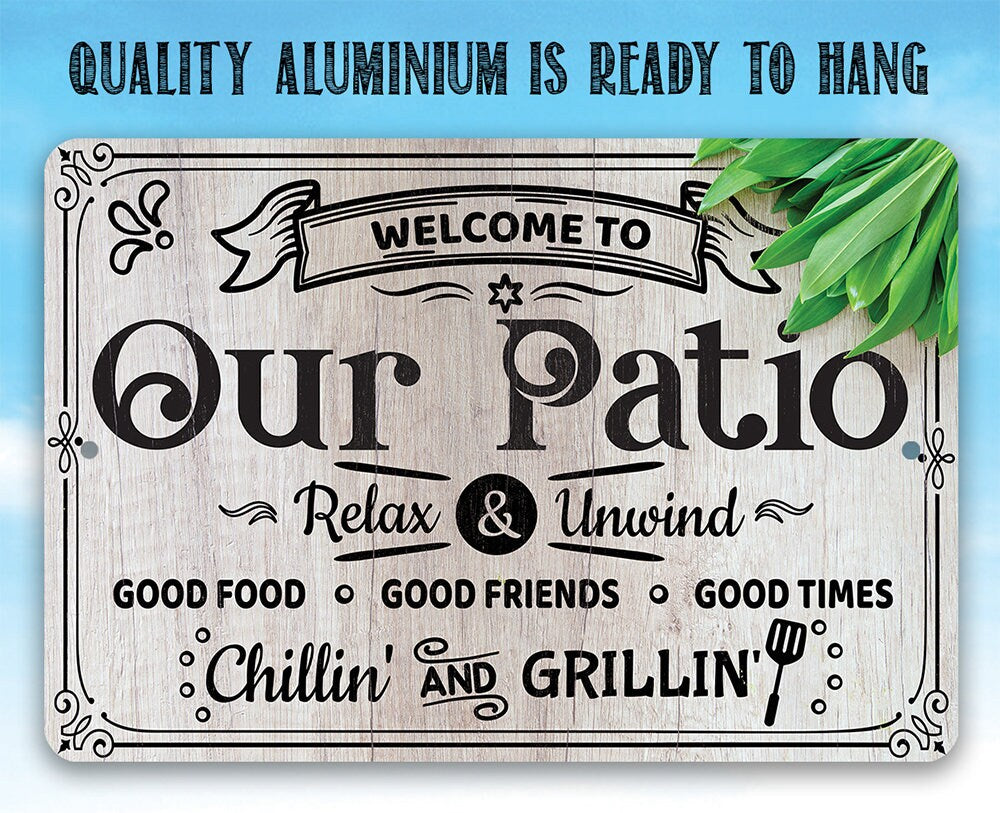 Metal patio welcome sign reading "Our Patio" with "Relax & Unwind" and "Chillin'" text.