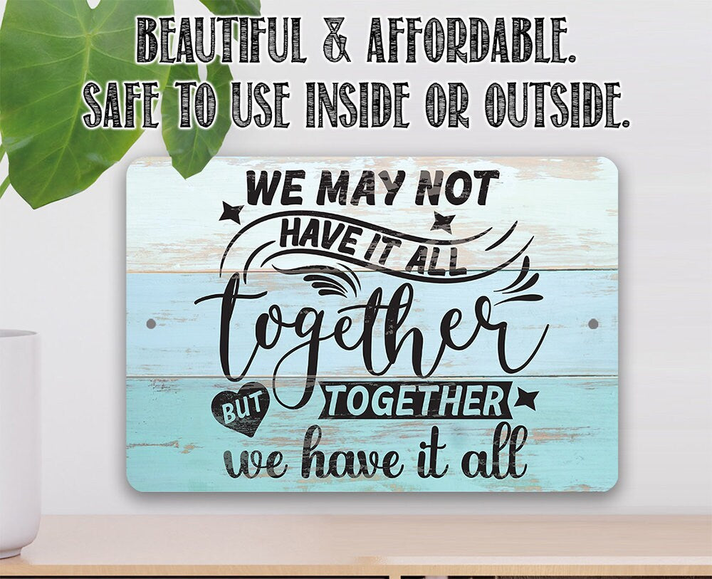 Light blue metal sign with 'Beautiful & Affordable' and 'We may not have it all' text.