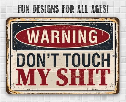 Distressed metal warning sign reading “WARNING DON'T TOUCH MY SHIT”