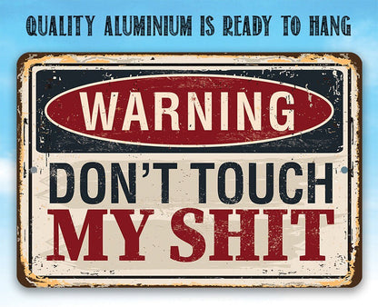 Distressed metal warning sign reading “WARNING DON'T TOUCH MY SHIT”