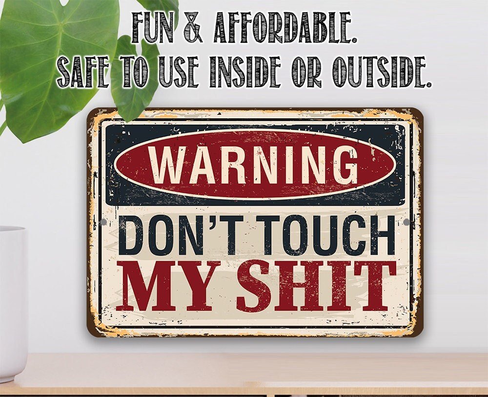 Distressed metal warning sign with “WARNING DON'T TOUCH MY SHIT” text in red and white