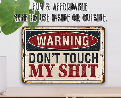 Distressed metal warning sign with “WARNING DON'T TOUCH MY SHIT” text in red and white