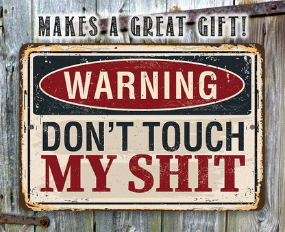 Distressed metal warning sign reading “WARNING DON'T TOUCH MY SHIT”
