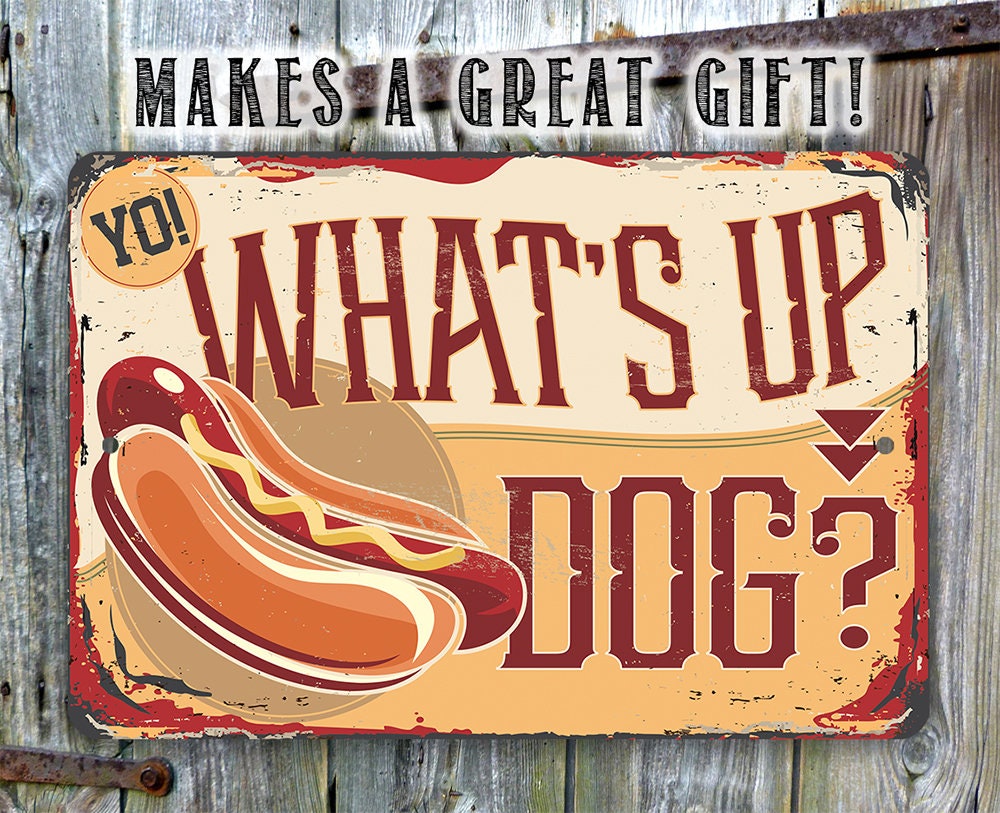 Aluminum metal sign showing hot dog graphic and bold “What’s Up Dog?” message